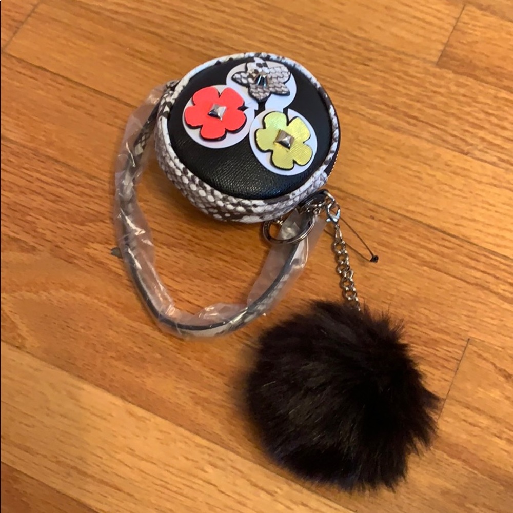 Macy’s wristlet with flowers and Pom Pom